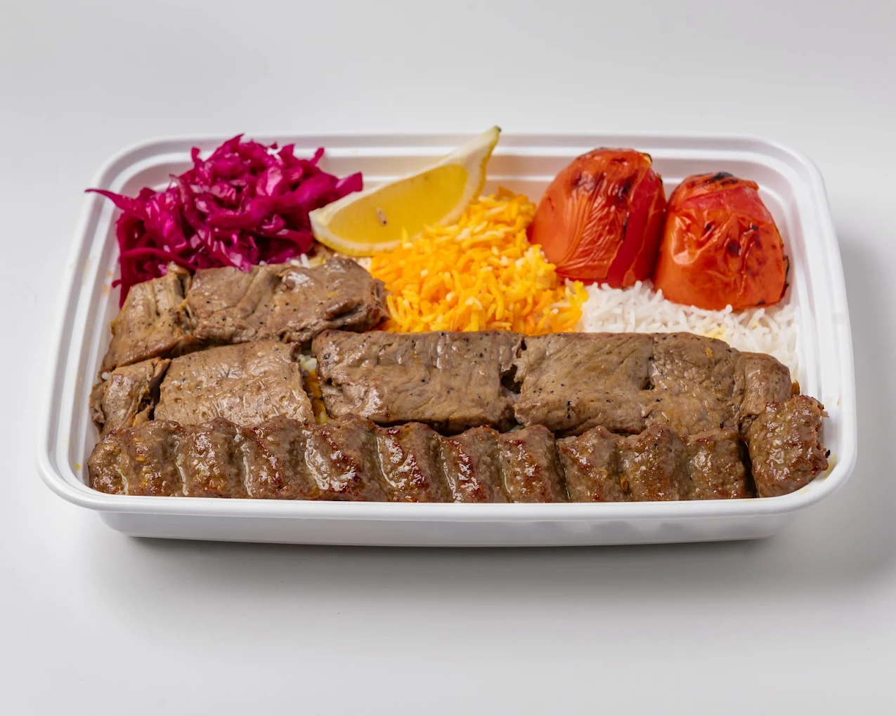 Platter of kabab and saffron rice for an office lunch